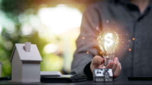 light-bulb-in-man-s-hand-investment-loan-approval-concepts_22422144