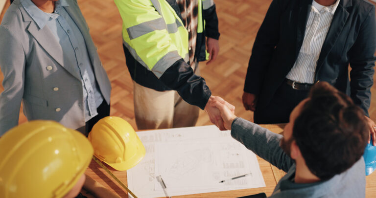 architect-investor-and-shaking-hands-at-worksite-for_84769782